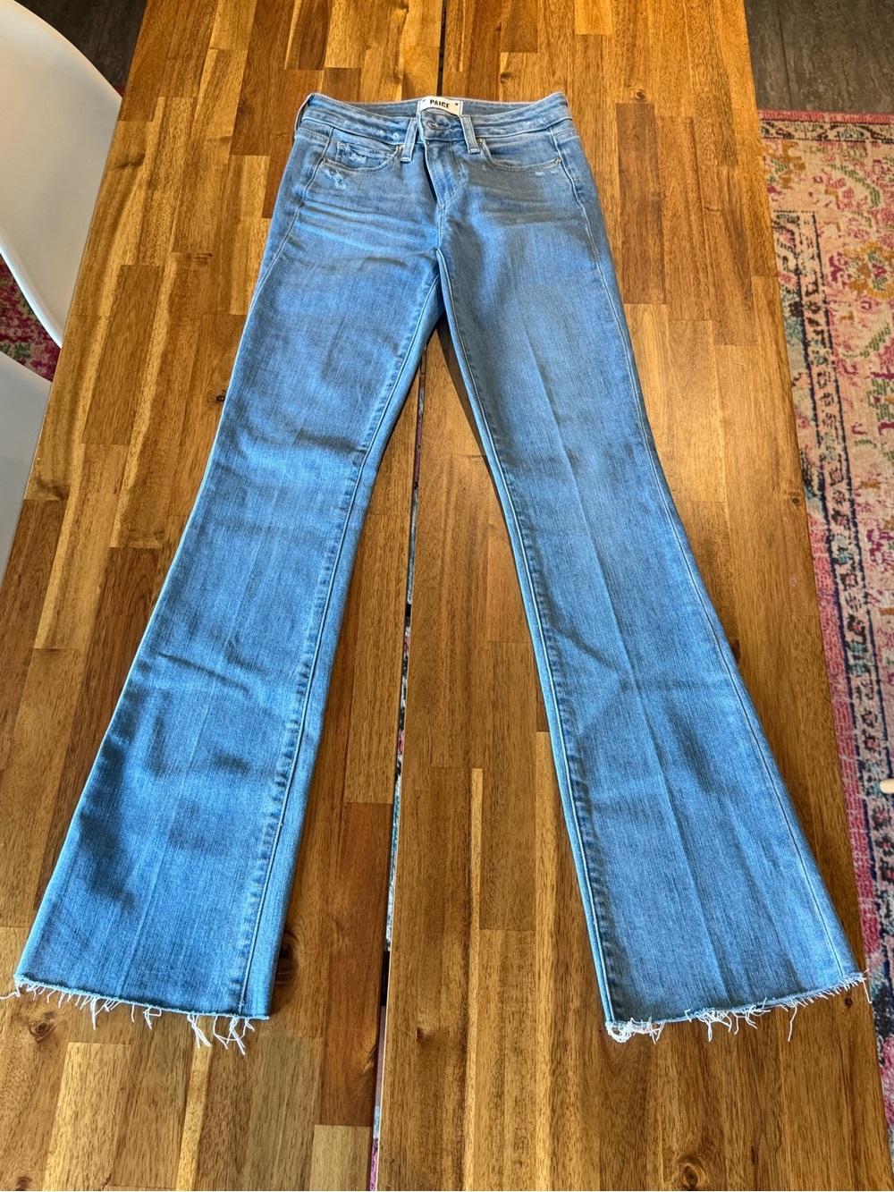 PAIGE Medium Wash Flare Jeans with Raw Hem 24